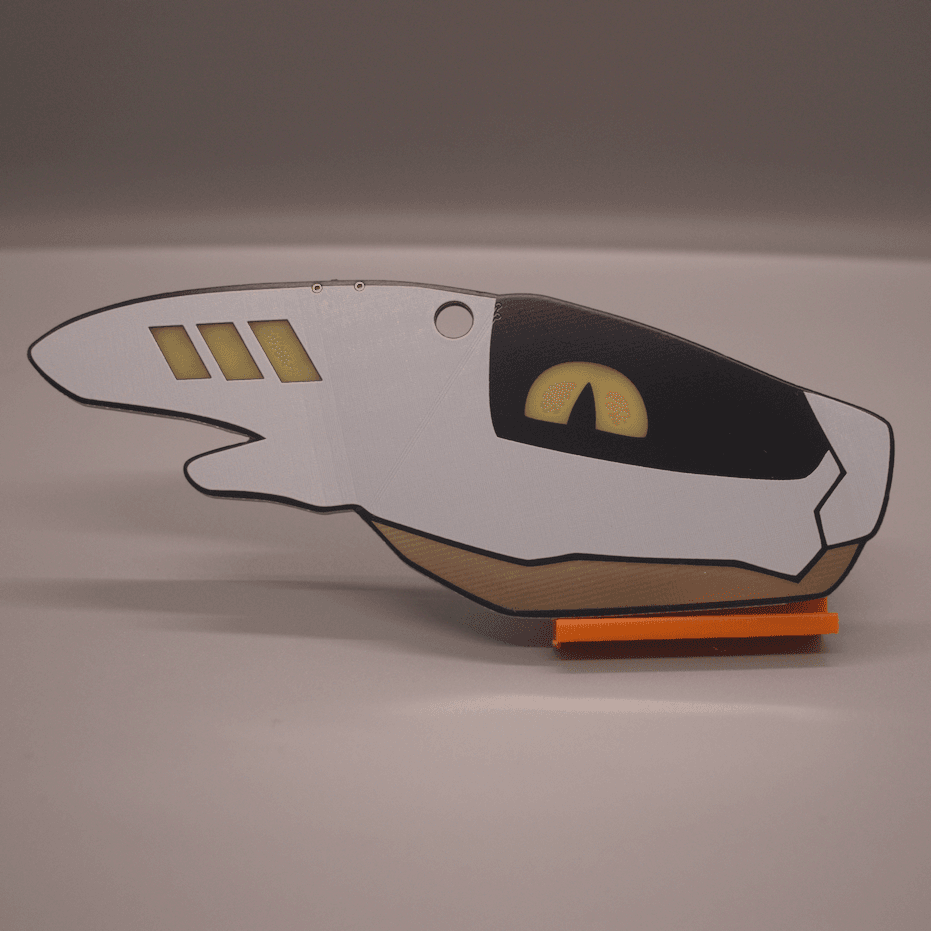 Photo of a PCB badge in the shape of a furry synth's head. The eye and three lights on the horn light up yellow. They have a white shell, a black visor, and a shiny copper jaw.